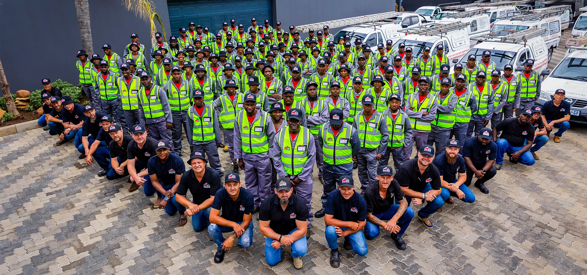 The full Sicon Group roofing team in branded uniforms and hi-vis at their Gauteng headquarters
