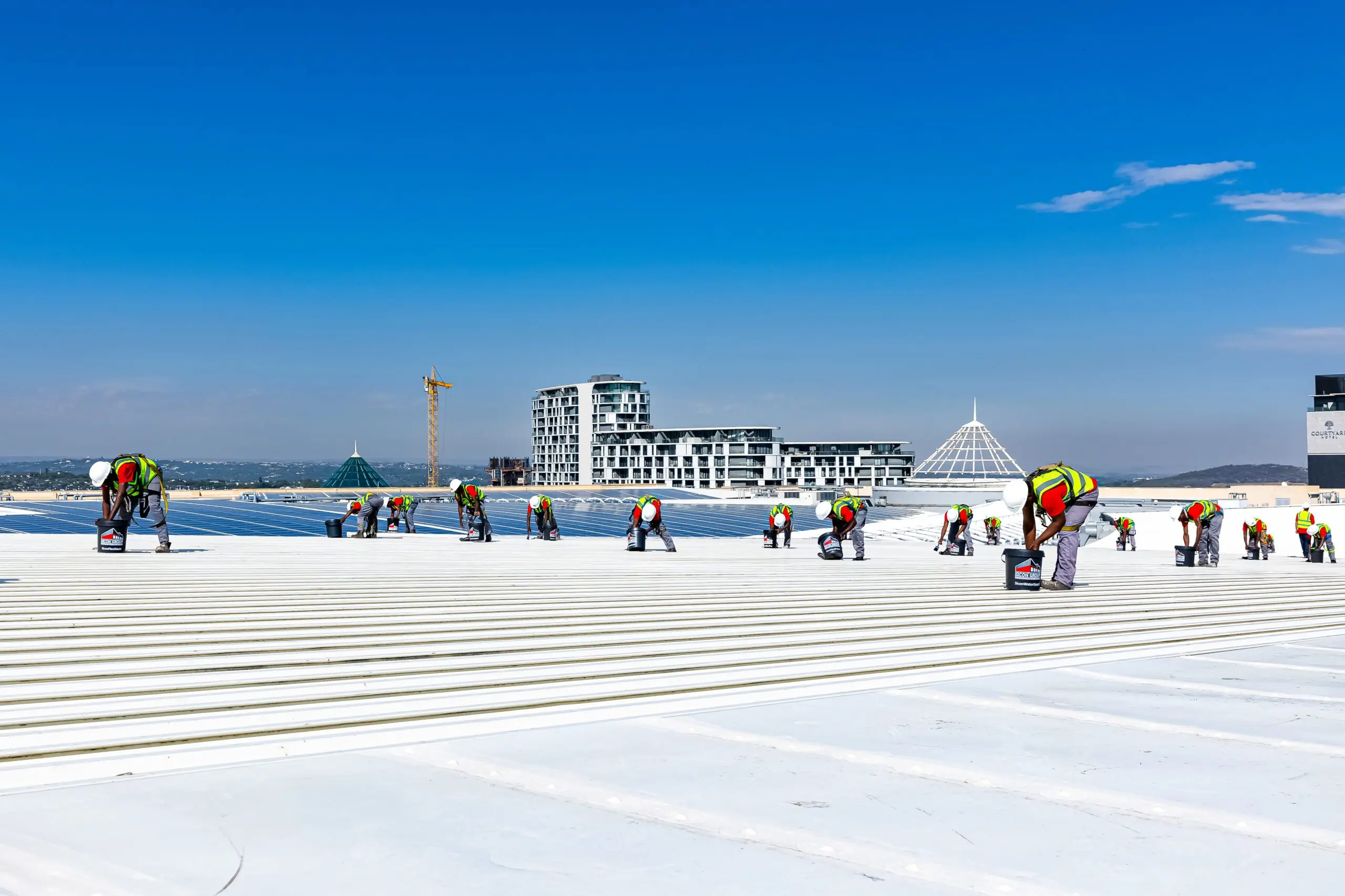 Sicon Group roofing team applying protective coatings on a large commercial roof in Johannesburg
