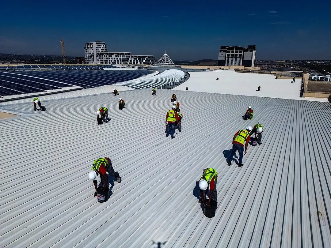 Sicon Group roofers coating a large commercial rooftop in Gauteng
