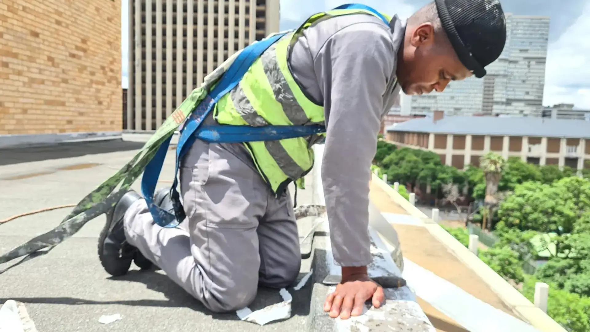 Sicon Group specialist grinding and prepping a metal roof surface during scheduled maintenance, Gauteng