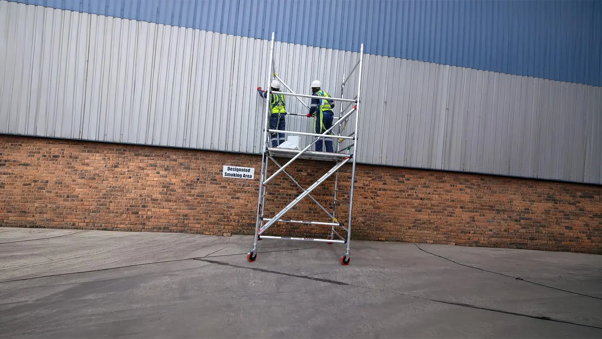 Technicians completing routine industrial roof maintenance to extend roof lifespan