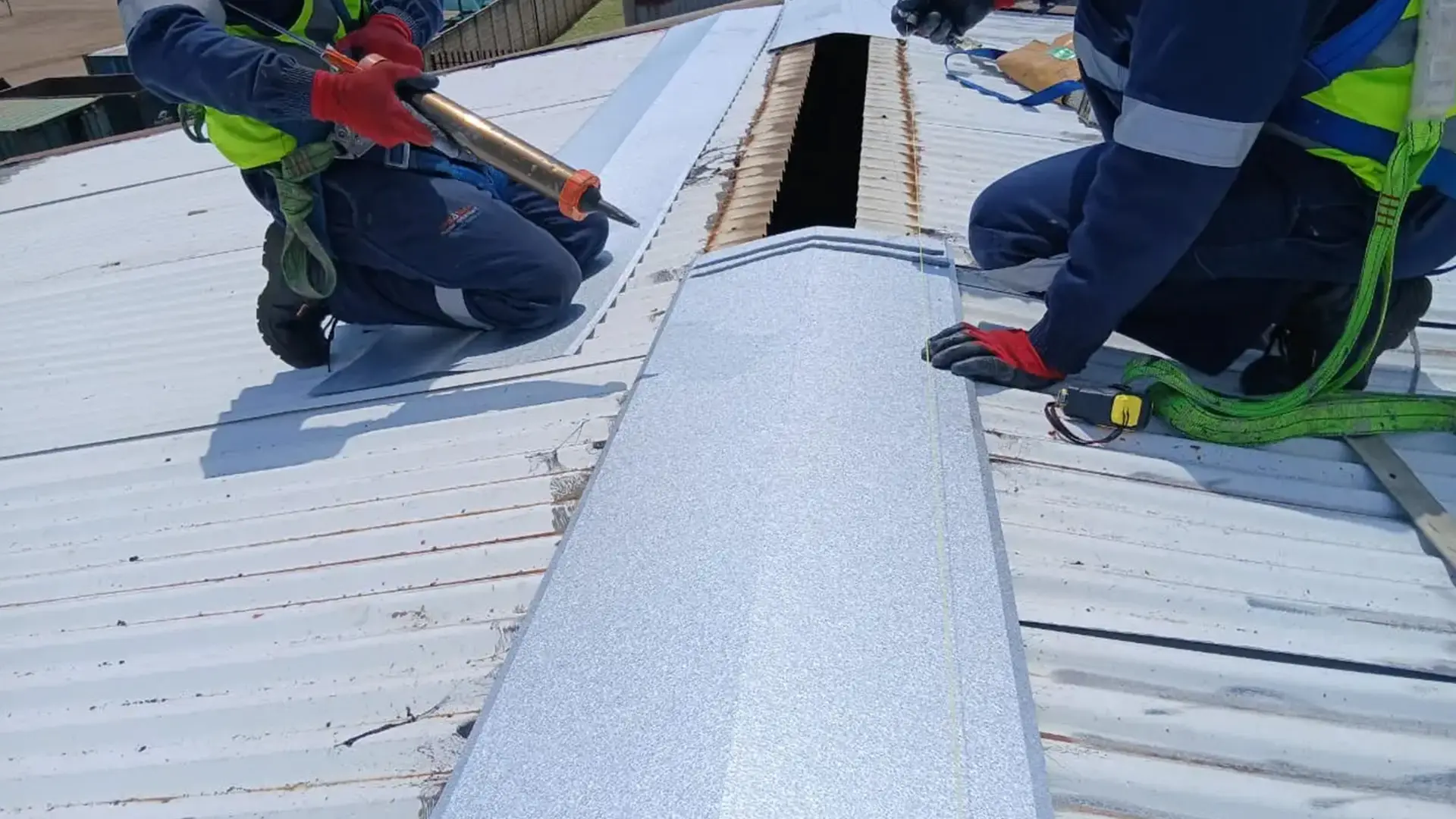 Sicon Group maintenance team treating early rust and corrosion on a large industrial roof, South Africa