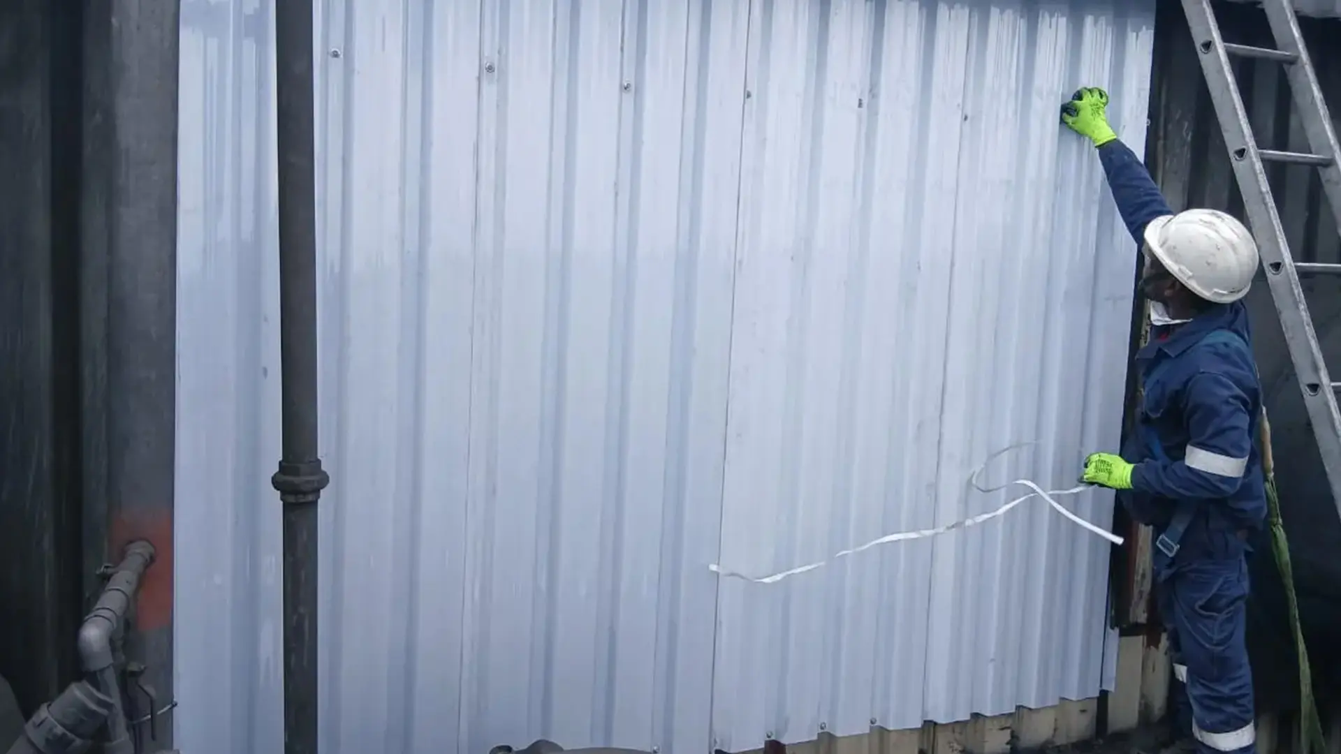 Sicon Group crew carrying out scheduled leak-sealing and coating maintenance across a large metal roof