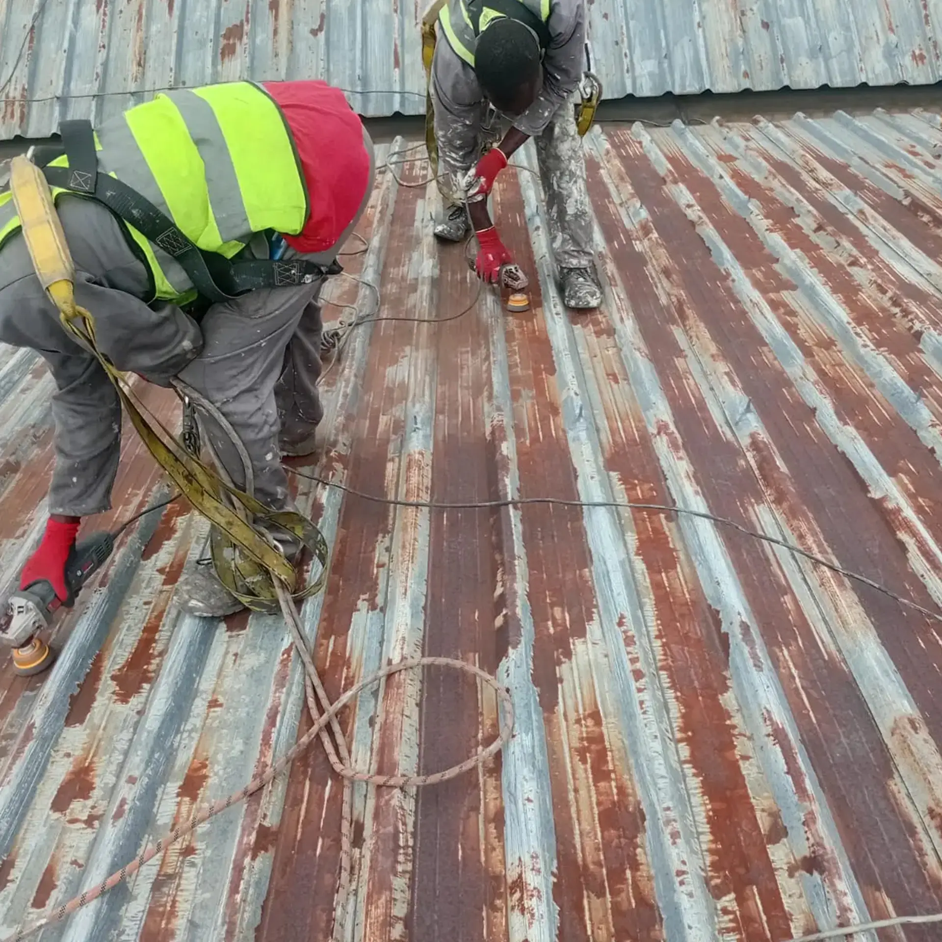 Sicon Group resealing rooftop seams during preventative maintenance on a commercial roof