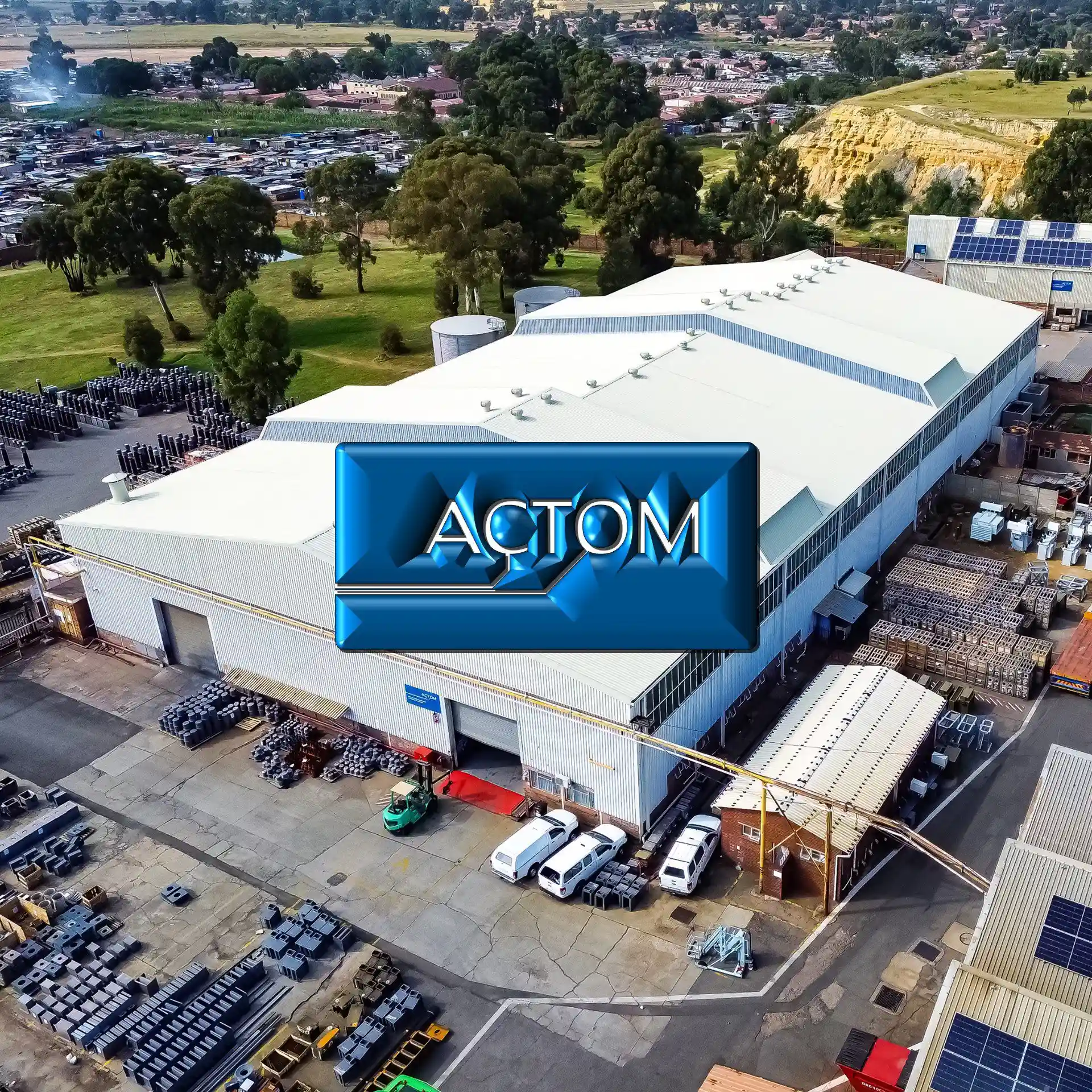 Aerial view of the ACTOM facility with its fully restored white roof by Sicon Group