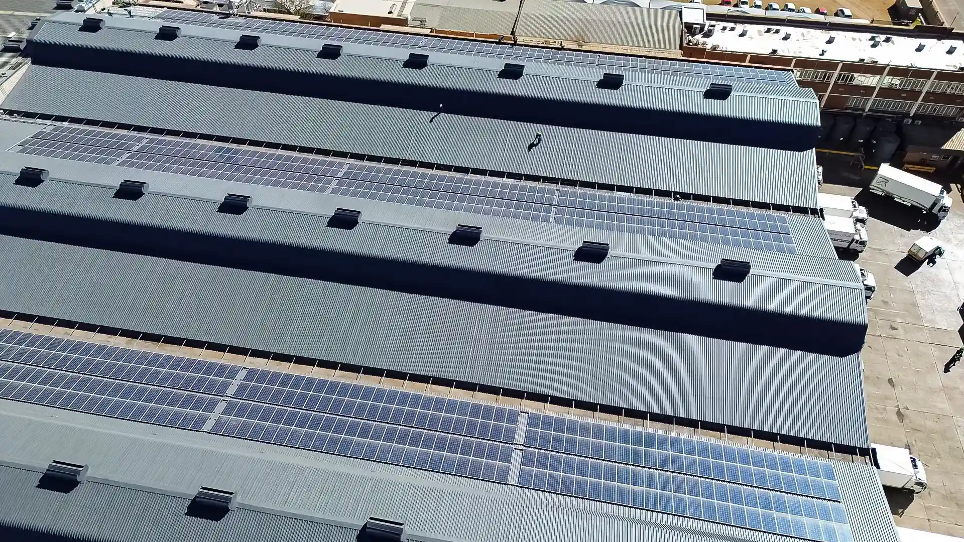 Aerial view of the restored Spar North Rand warehouse roof with solar arrays after Sicon Group waterproofing and protective coating, Gauteng