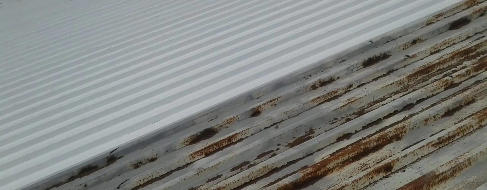 Sicon Group technicians applying rust and corrosion control treatment to an industrial metal roof in Gauteng