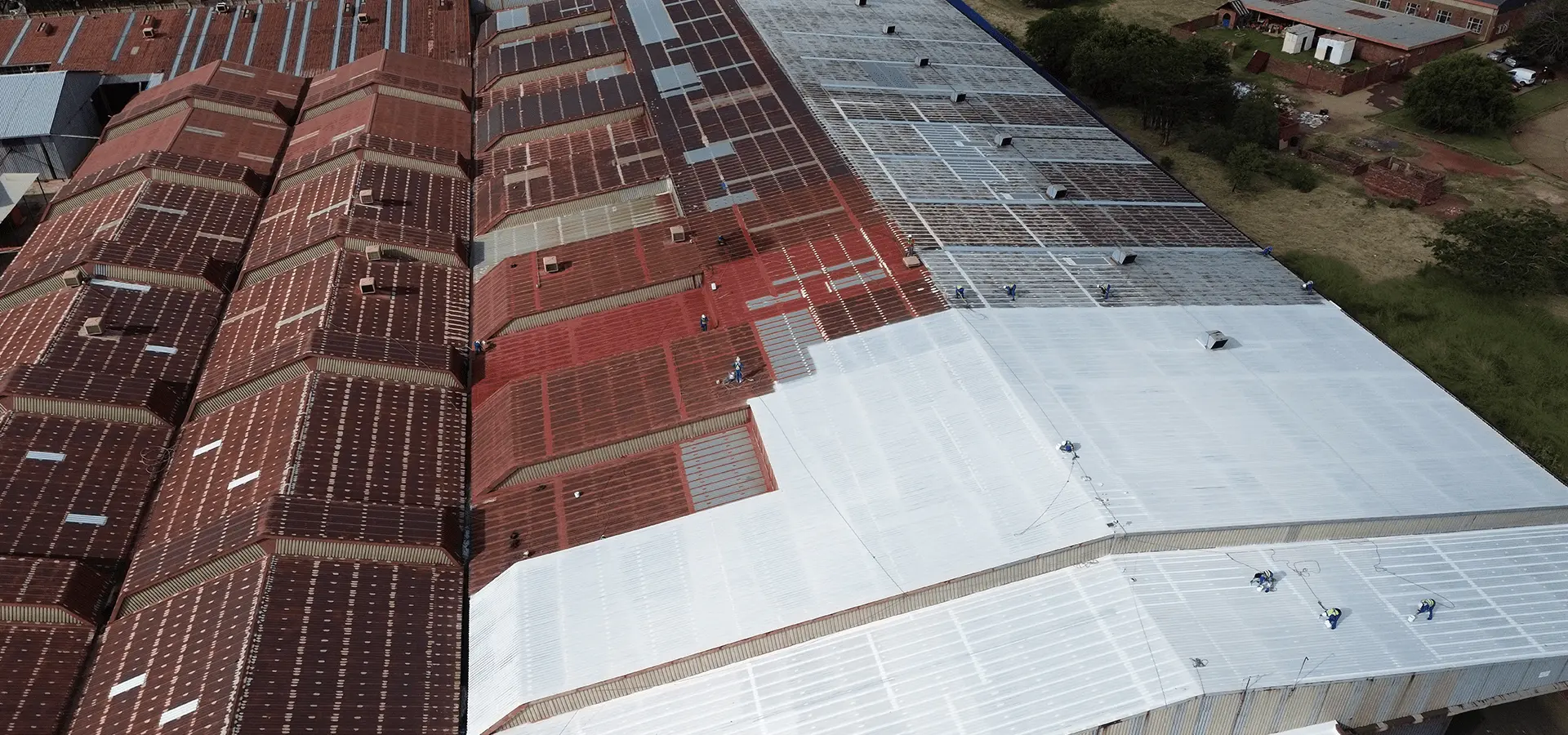 Sicon Group technicians applying rust and corrosion control treatment on a commercial roof in South Africa